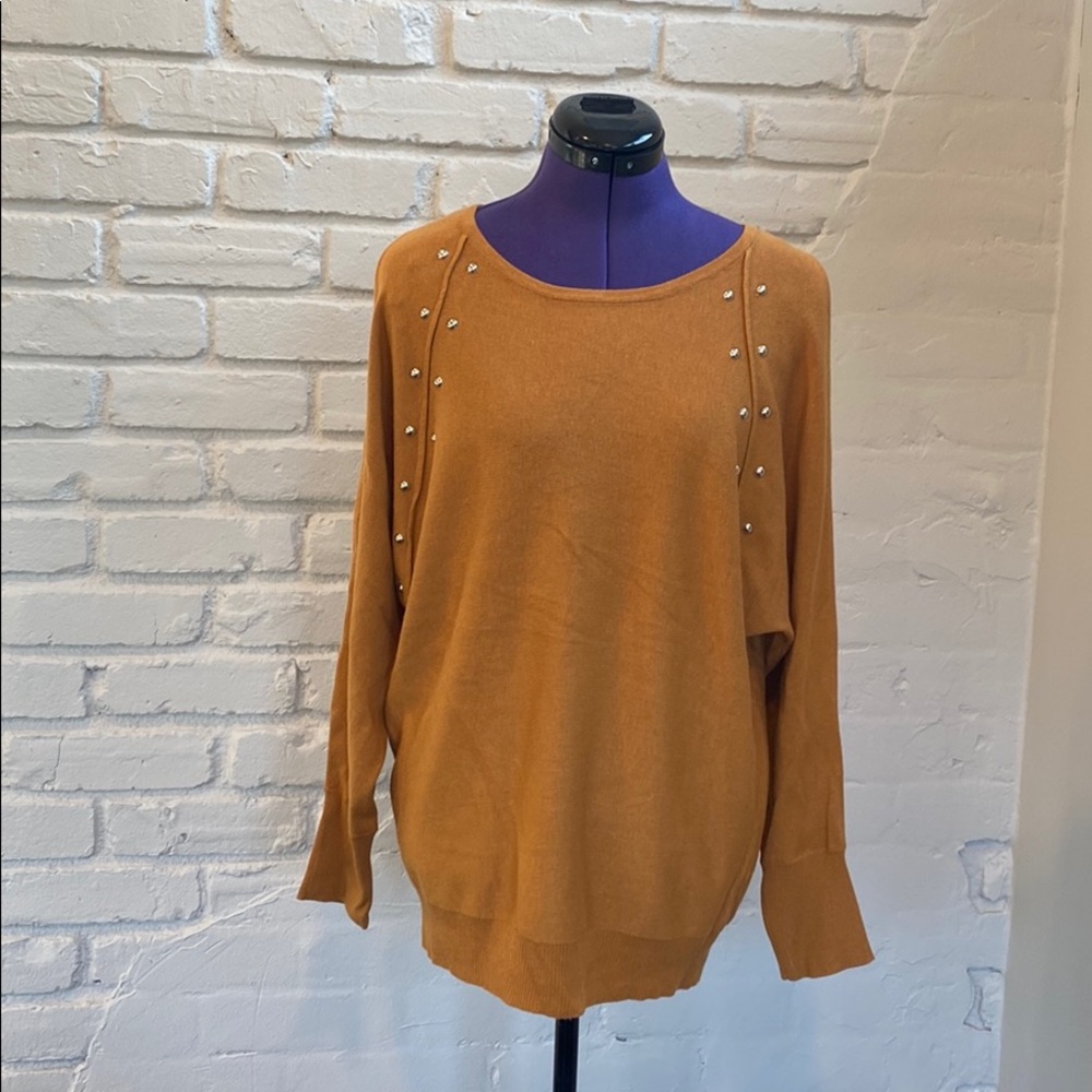 Jennifer Lopez cold shoulder sweater